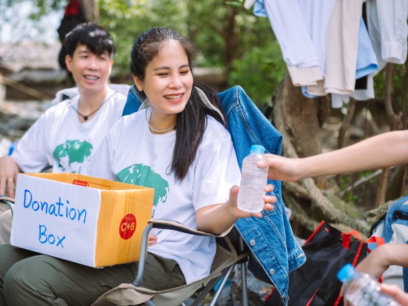 group-of-asian-diverse-people-volunteer-holding-a-donation-box-for-fundraiser-to-emergency-situation.jpg